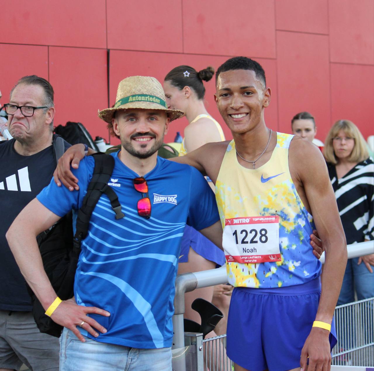 Manuel Hein wearing a blue running shirt and a straw hat